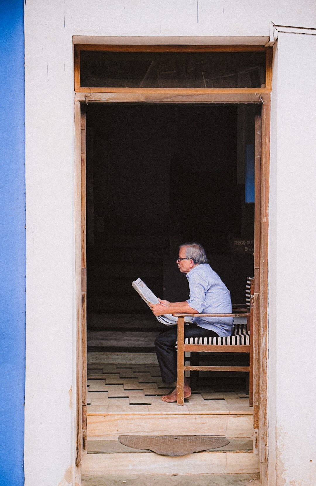 happy senior reading newspaper